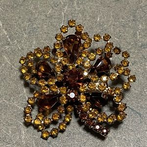 Vintage brooch amber and brown stones.